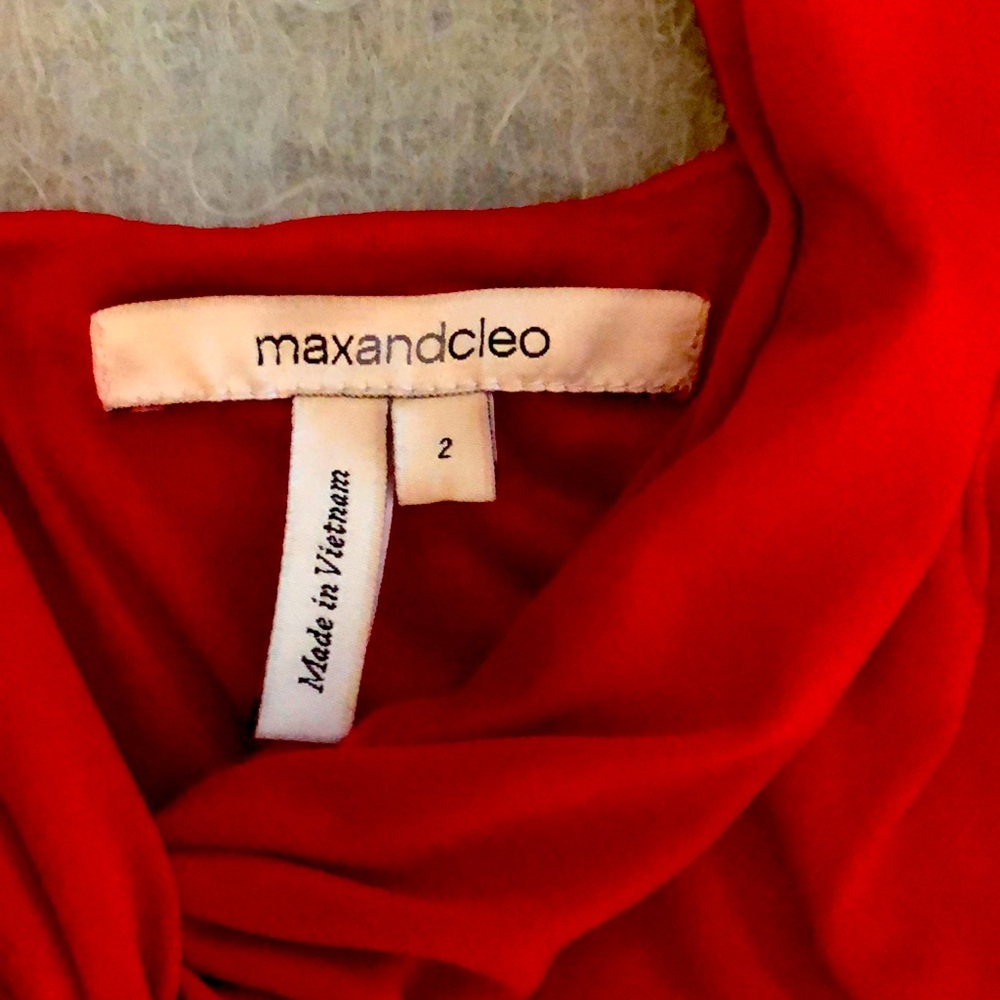 Very pretty red knit halter dress; zip back slightly shorter front, knit lining.